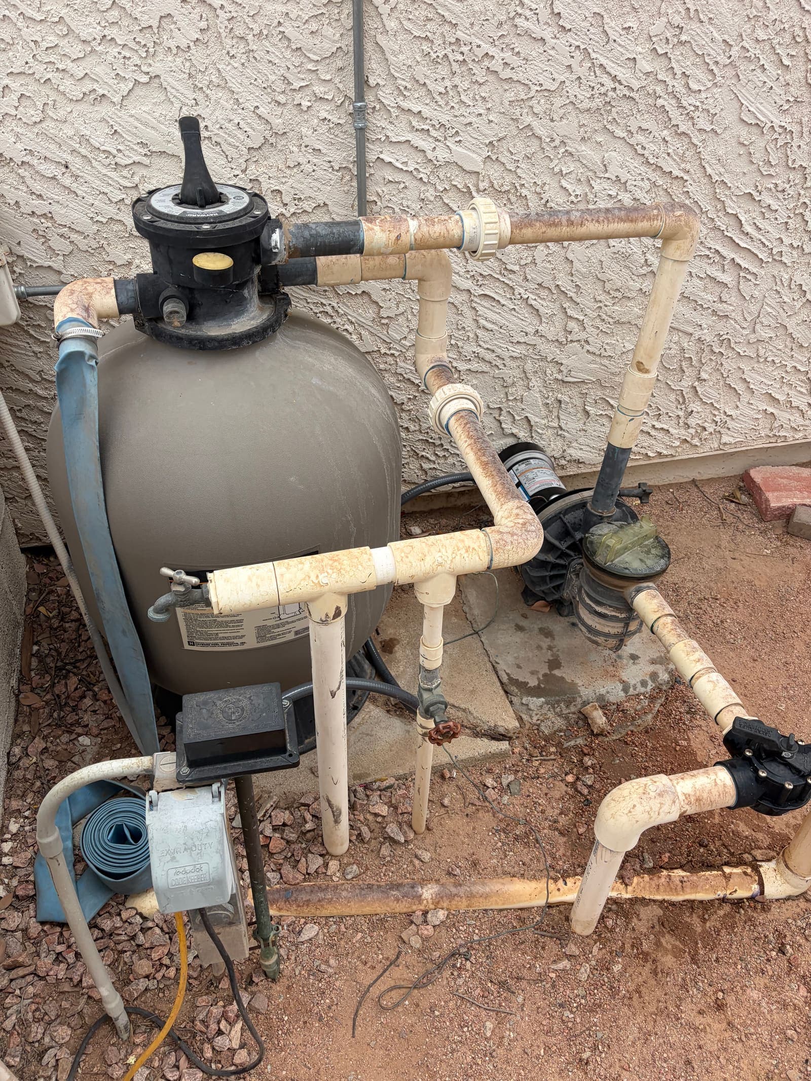 Leaf vacuum working across a pool floor during a cleanup visit